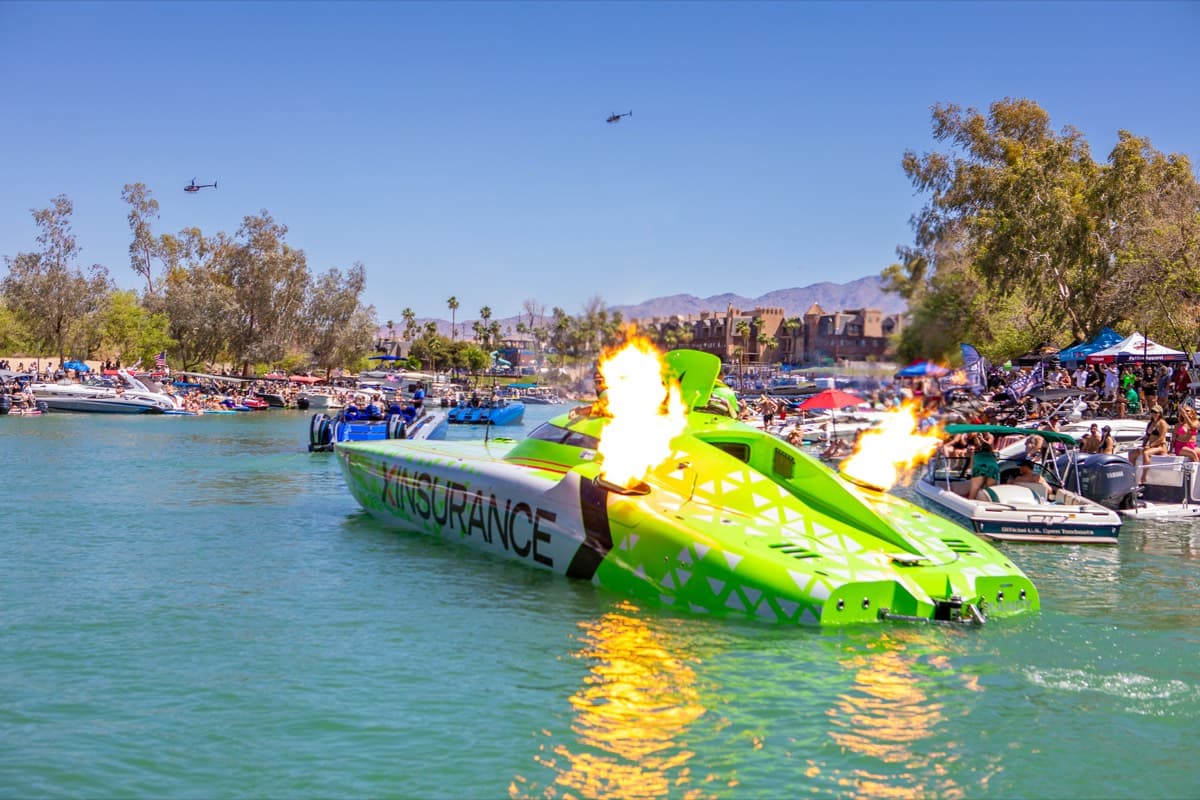 A raceboat running hard through the channel
